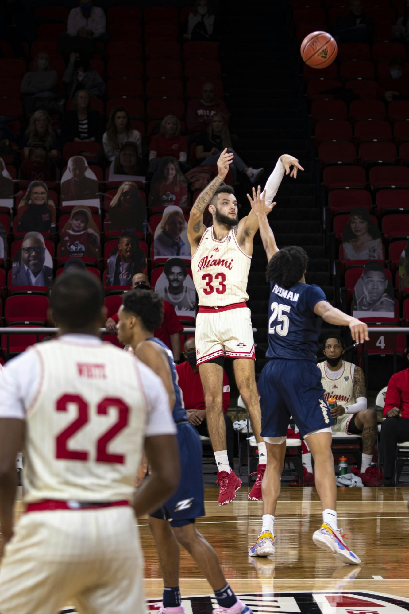 Junior forward Eli McNamara shoots a mid-range jumper over an Akron defender during an 83-76 loss on Feb. 12 at Millett Hall.