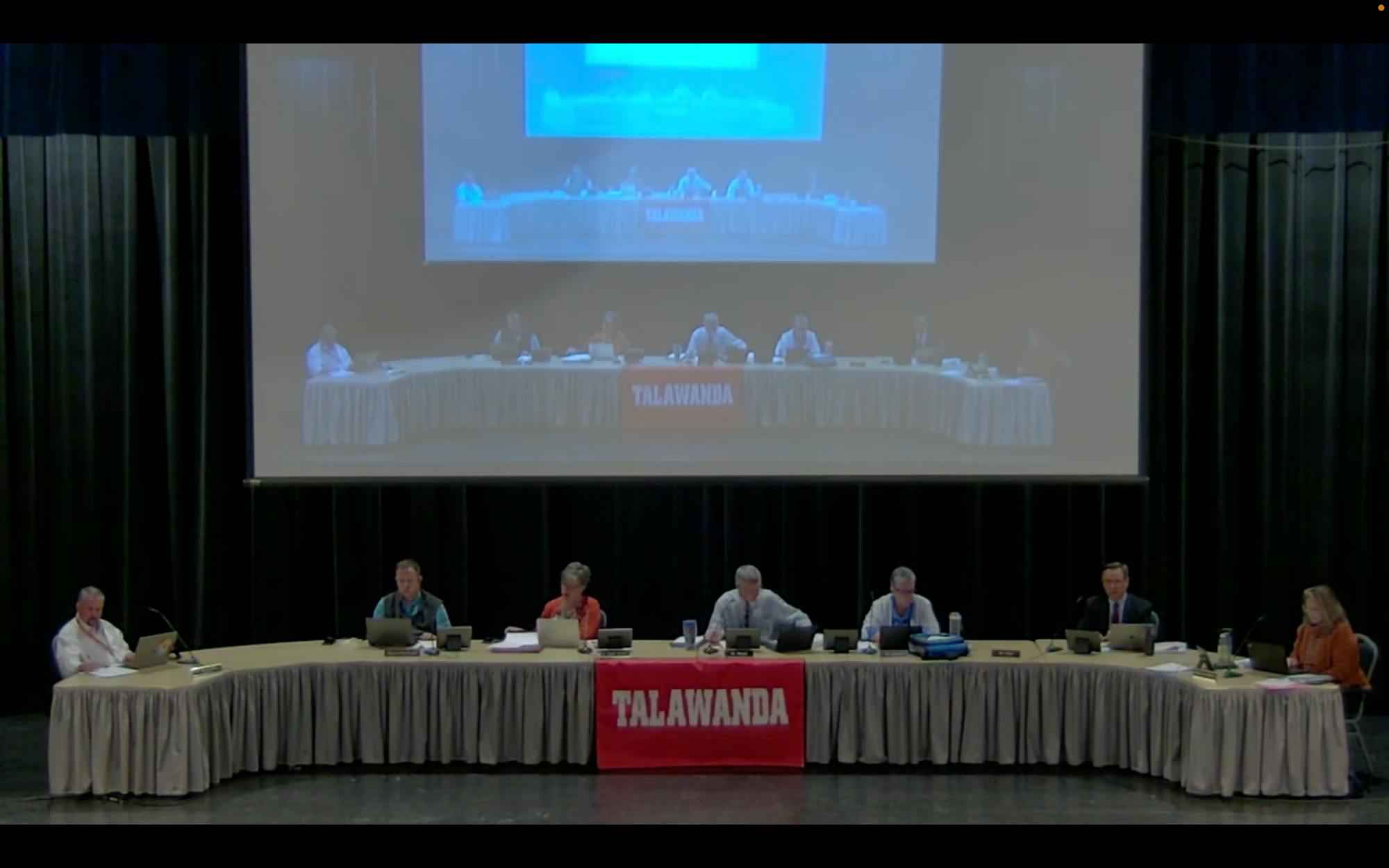 Talawanda School District Board of Education members David Bothast, Kathleen Knight-Abowitz, Pat Meade, Rebecca Howard and Chris Otto meet at Talawanda High School’s Performing Arts Center, along with Superintendent Ed Theroux and Treasurer Shaunna Tafelski.