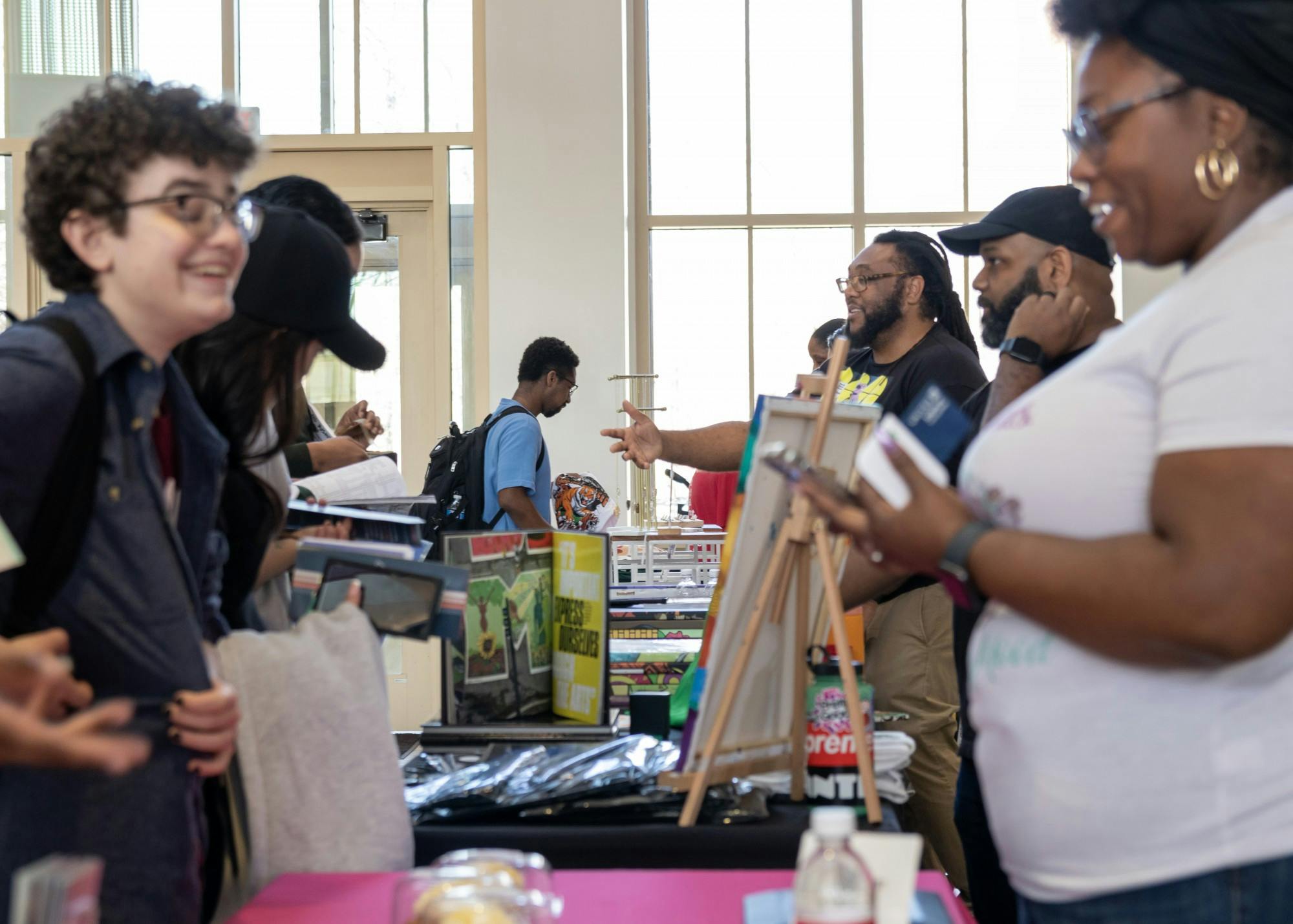 Students browse and talk with the owners of the small businesses that set up in Armstrong’s atrium on Thursday.