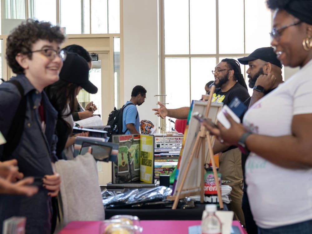 Students browse and talk with the owners of the small businesses that set up in Armstrong’s atrium on Thursday.