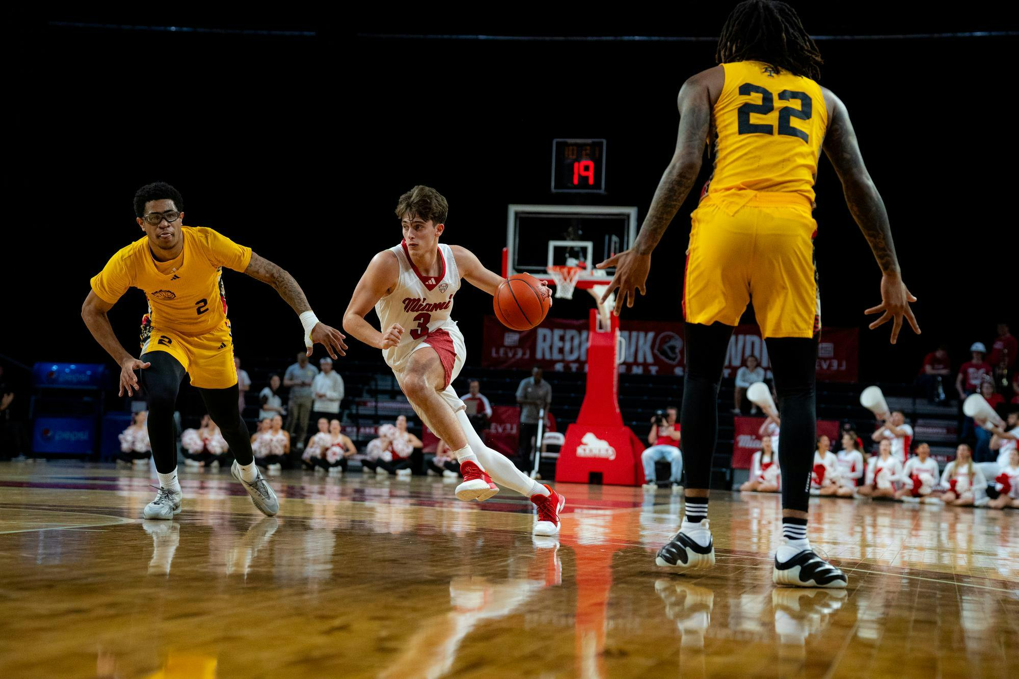 Sophomore guard Luke Skaljac dribbles against the Golden Dragons at Millett Hall on Nov. 23