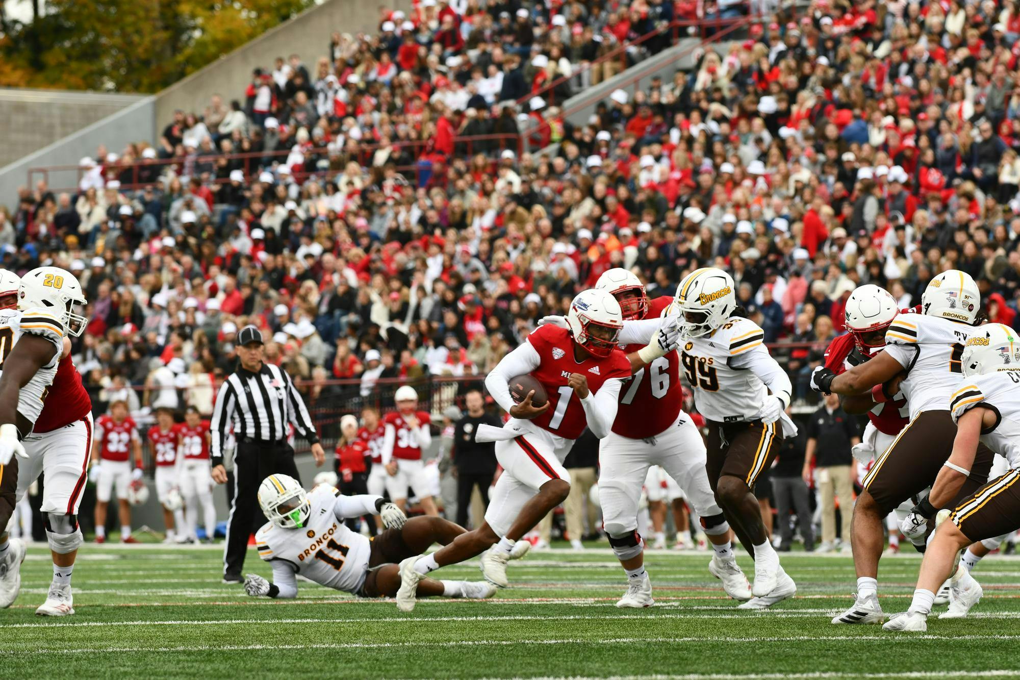 Seventh-year quarterback Dequan Finn takes off for a scramble against Western Michigan at Yager Stadium on Oct. 25
