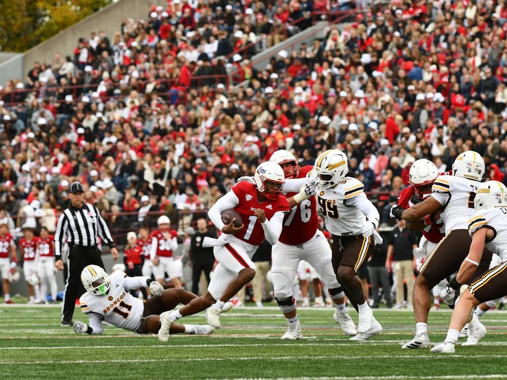 Seventh-year quarterback Dequan Finn takes off for a scramble against Western Michigan at Yager Stadium on Oct. 25