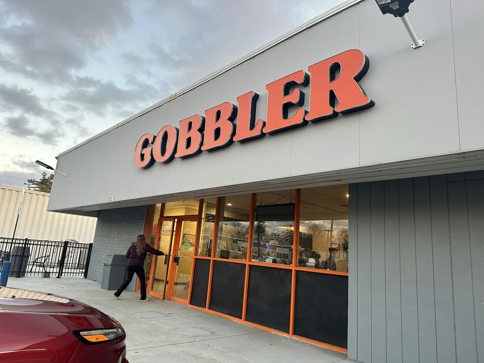 Oxford's first fried chicken restaurant draws customers with its large orange sign on Spring St. 