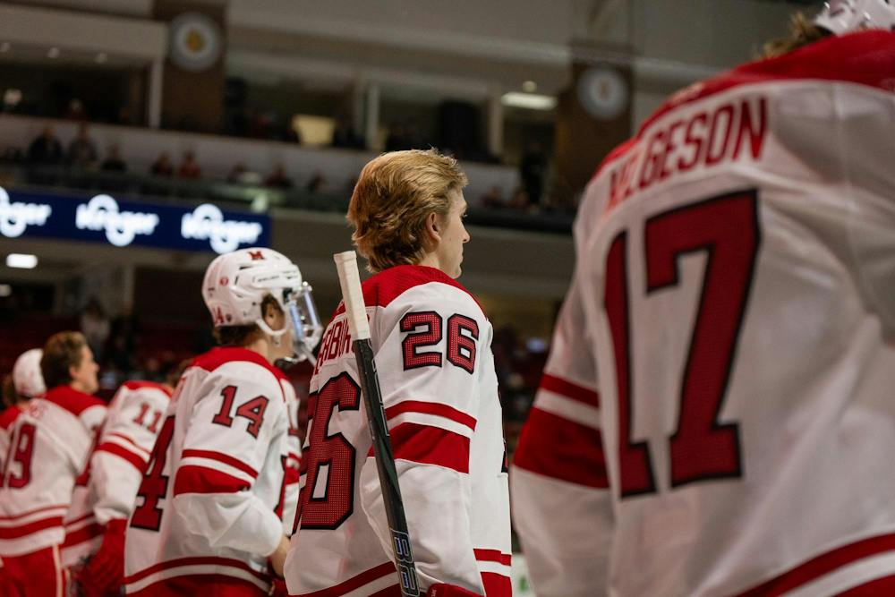 Miami hockey team stands for the national anthem at beginning of game against Arizona State University. 