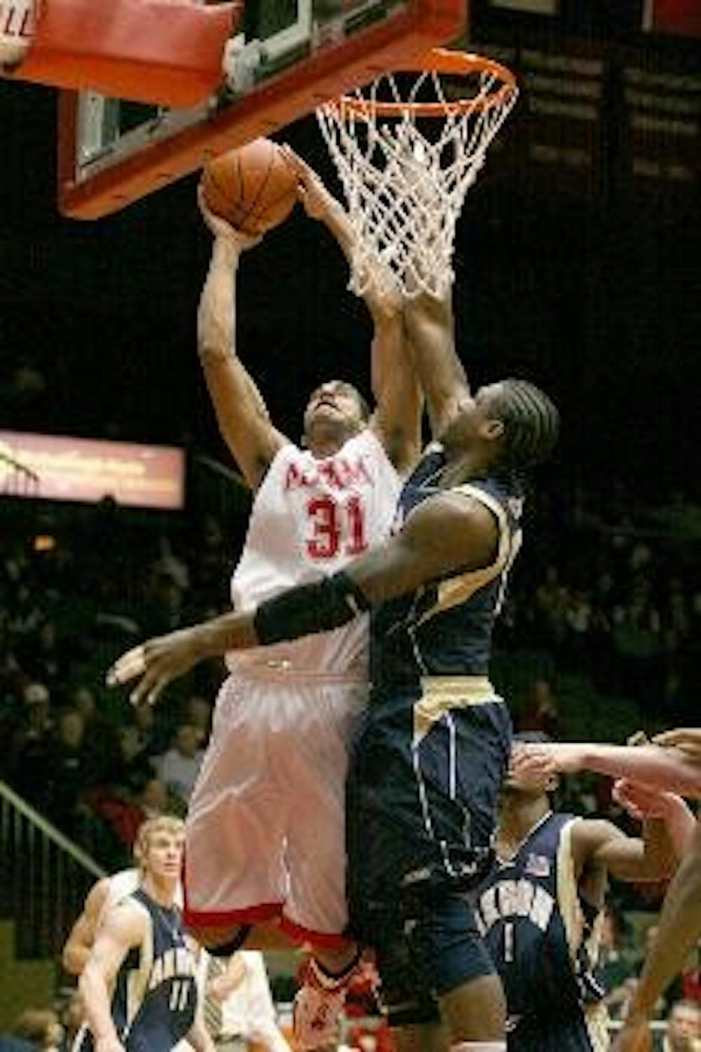 Miami's Nathan Peavy goes up for two of his 14 points against Akron's Jeremiah Wood Wednesday night at Millett Hall.