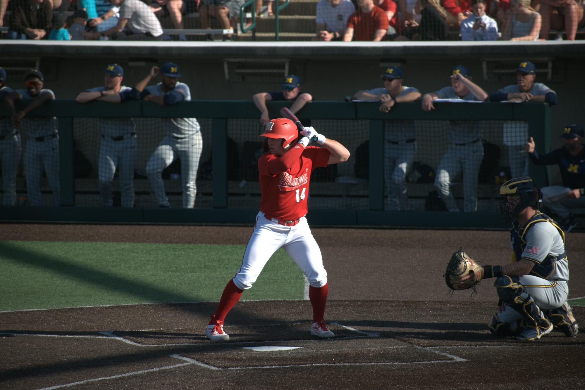 Sophomore catcher Carson Raether stands in the batters box in game against the University of Michigan after his walk-up song "Fat Bottomed Girls" plays. 