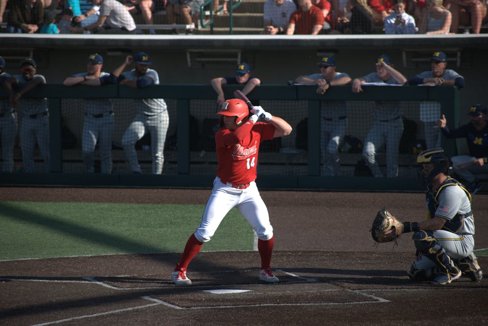Sophomore catcher Carson Raether stands in the batters box in game against the University of Michigan after his walk-up song "Fat Bottomed Girls" plays. 