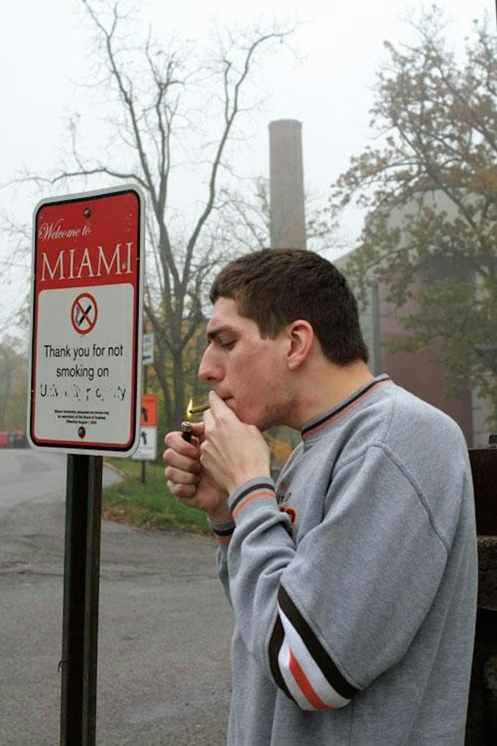 Mike Chioran smokes a Cigarillo on Western Campus.