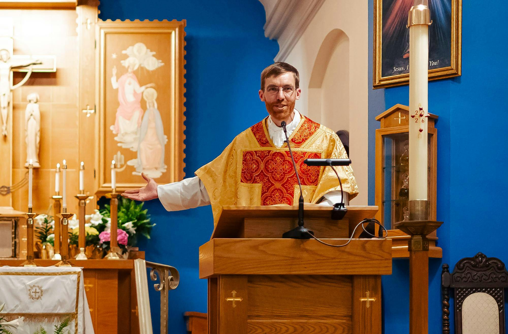 At the Easter Vigil, Fr. Jacob Willig speaks directly to the new Catholics, encouraging them in faith. Photo by Faith Wren