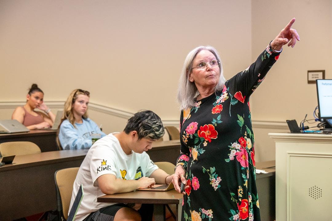 Professor Terri Barr presents a lecture on employee well-being in the Farmer School of Business. 