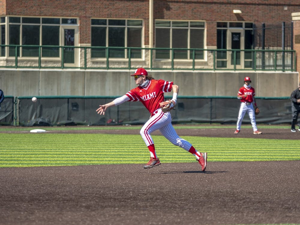 Graduate student second baseman Will Vogelgesang flips the ball to first base during Miami's weekend series vs Toledo