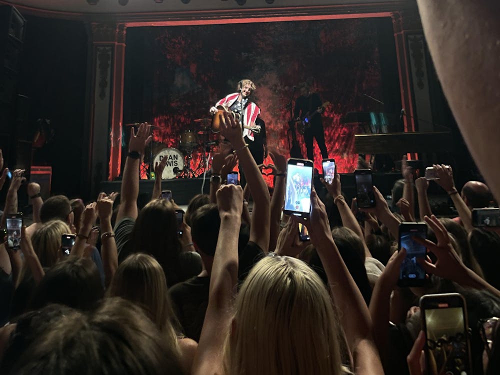 Fans put their hands in the air as Dean Lewis performs at the Newport Music Hall.