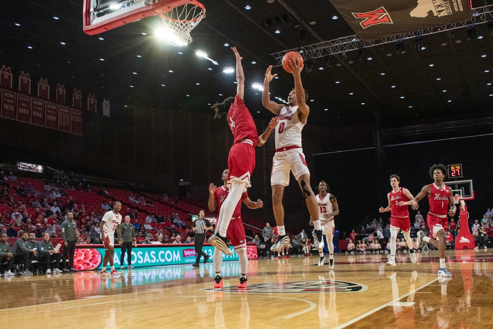 Sophomore wing Eian Elmer going for a shot against Northern Illinois at Millett Hall on Feb. 25