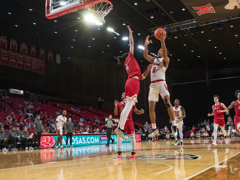 Sophomore wing Eian Elmer going for a shot against Northern Illinois at Millett Hall on Feb. 25
