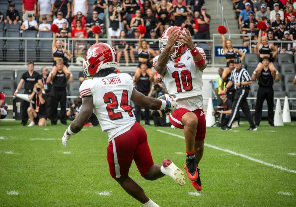Scoop Smith performs a trick play during the game against University of Cincinnati.