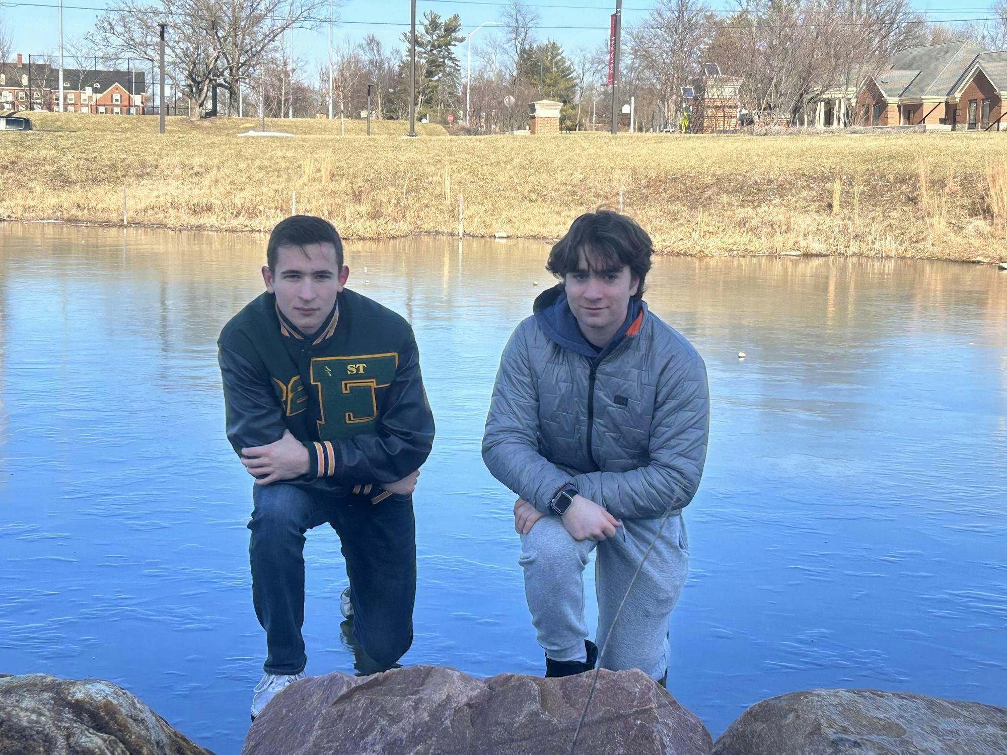 Michael and Connor stand proudly after walking on water