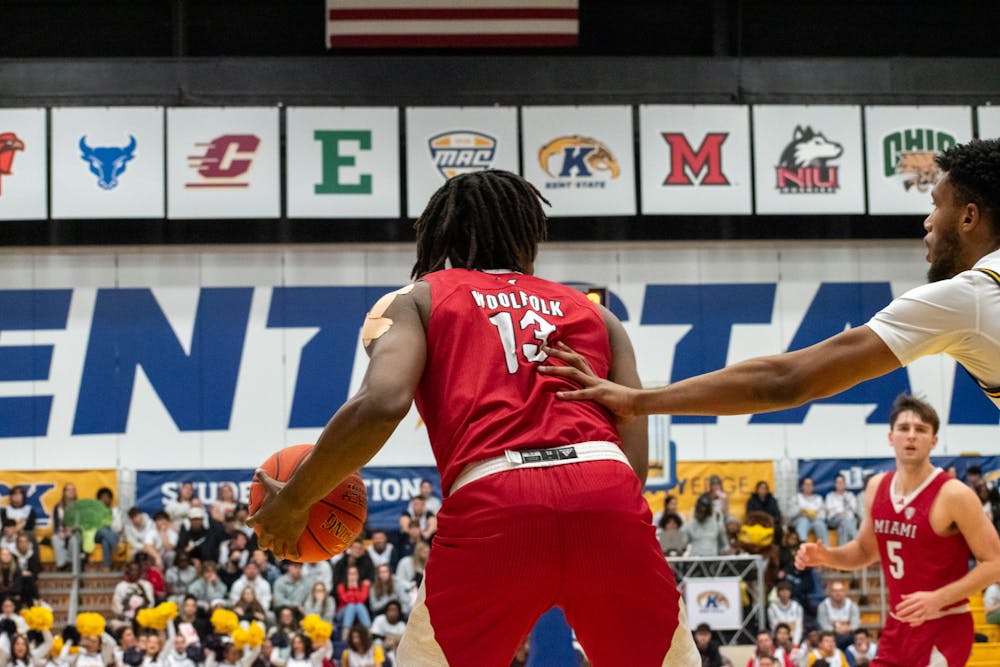 Junior forward Antwone Woolfolk dribbling against Kent State on Jan. 18