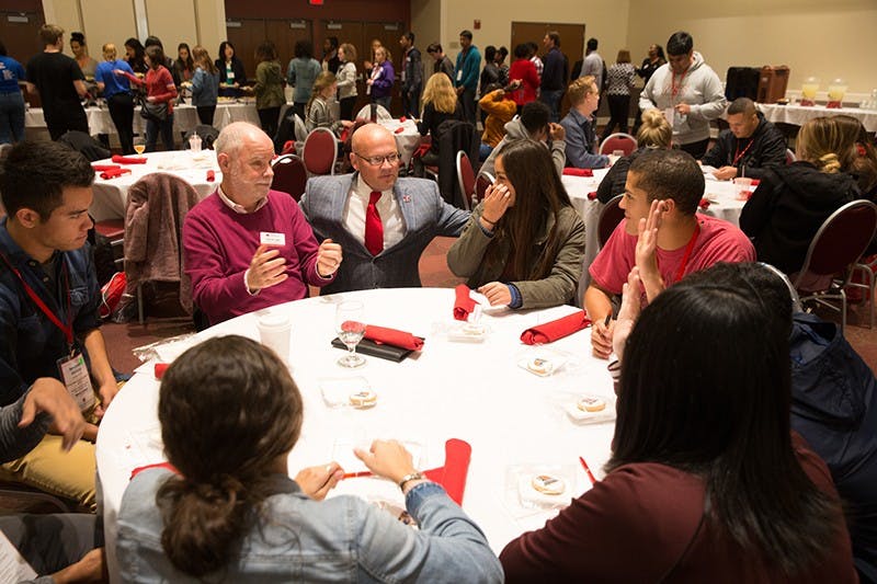 President Gregory Crawford has lunch with a group of Bridges Scholars back in 2017. The prestiged program celebrates its 40th anniversery this year.