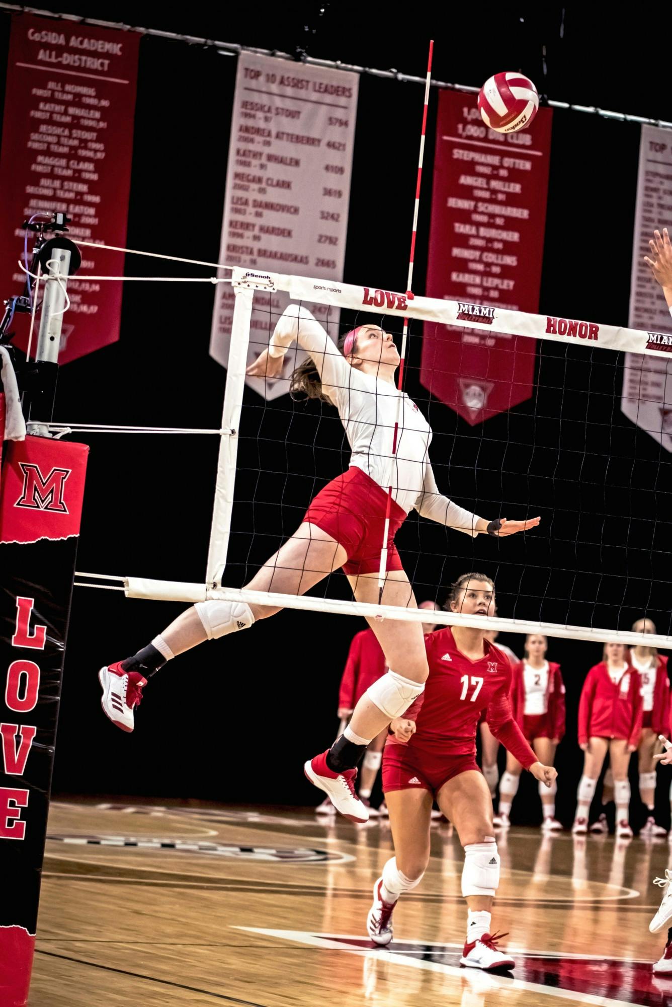 Senior libero Abigail Huser (pictured, in red) recorded a team-high 38 total digs in Miami&#x27;s weekend series against Western Michigan
