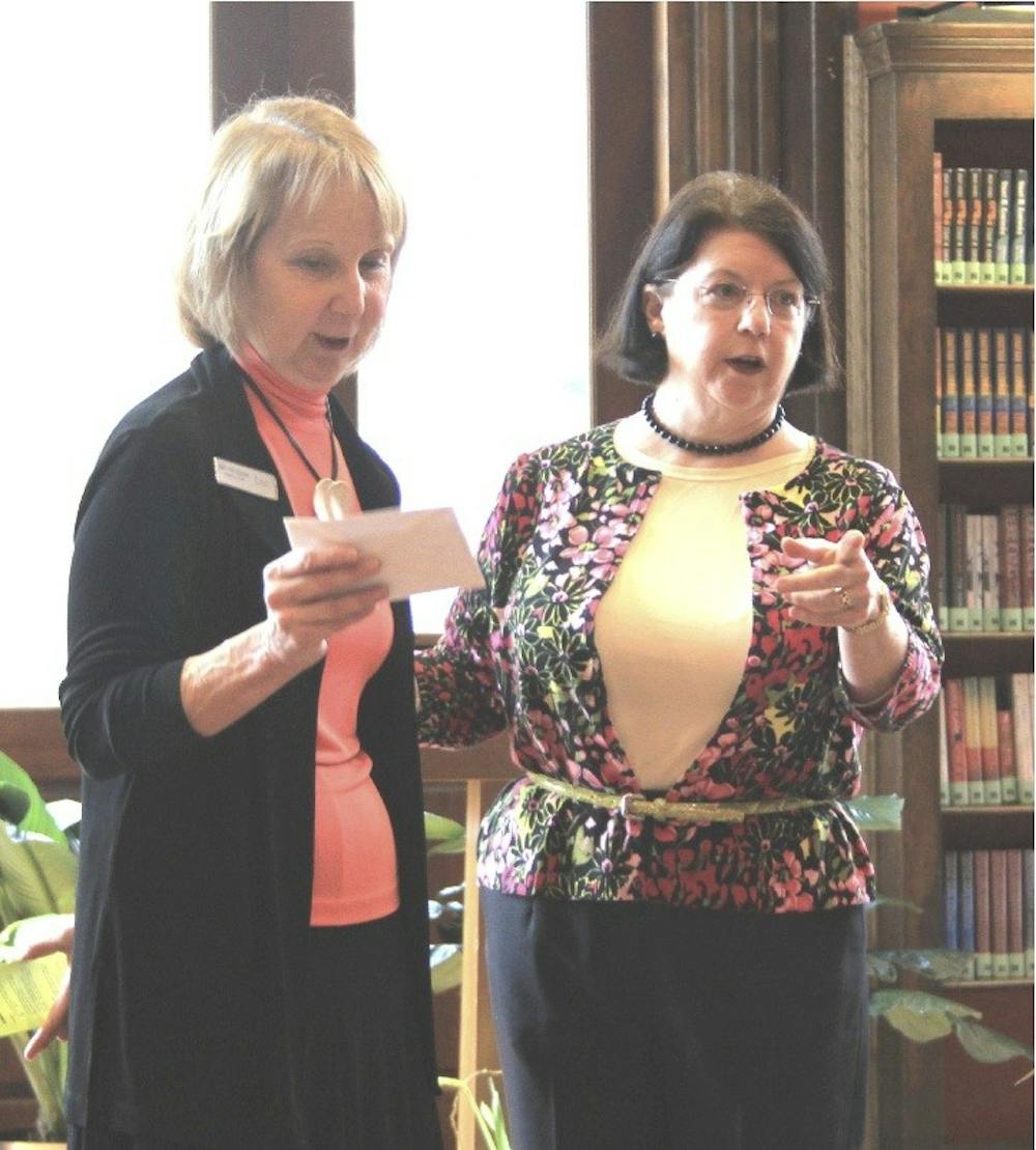 Mary Pat Essman (left), director of Lane Libraries, and Ann Berg (right), president of Friends of Hamilton-Fairfield Lane Libraries, speak Saturday afternoon at the Hamilton branch to inform and encourage Butler County residents to support the upcoming levy.