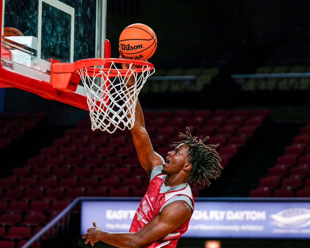 Woolfolk slamming a dunk during practice weeks before Miami’s season-opener