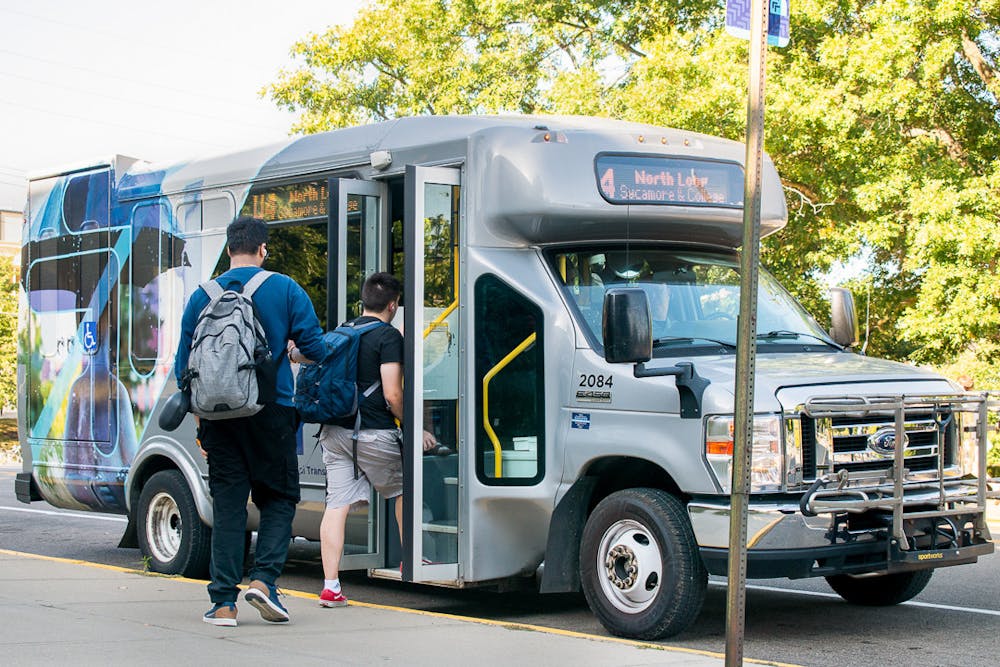 Miami students get on the BRCTA bus at the Miami Station stop.