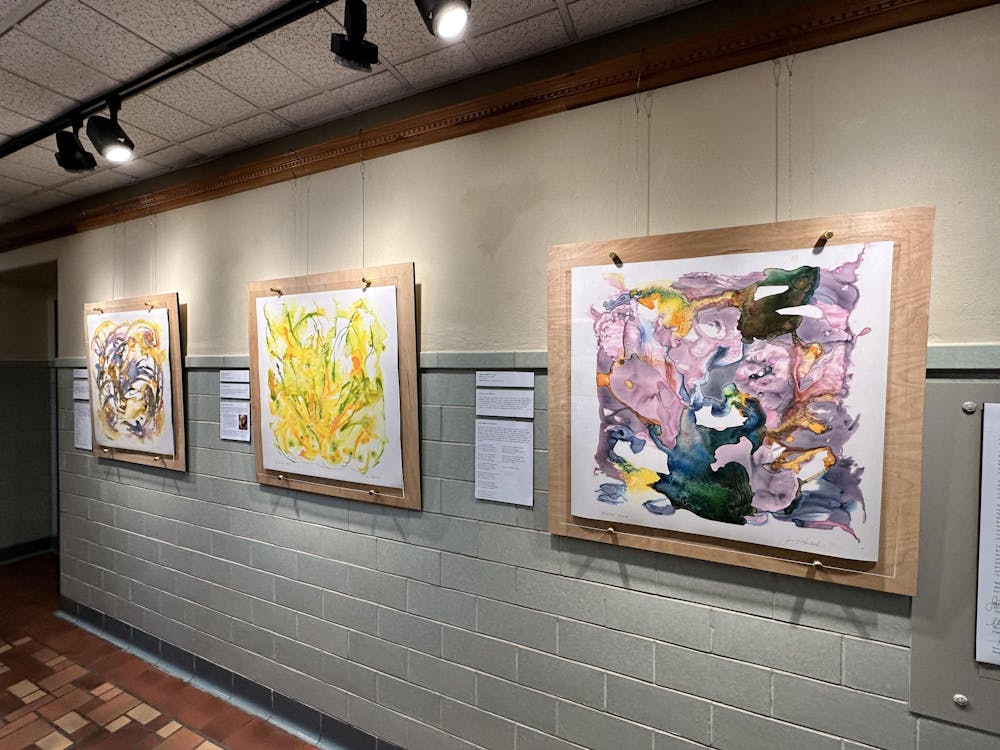 <p>Kruticks three paintings on display along the hallway leading to the Hefner Museum. From left to right: animal, vegetable, mineral. ﻿</p>