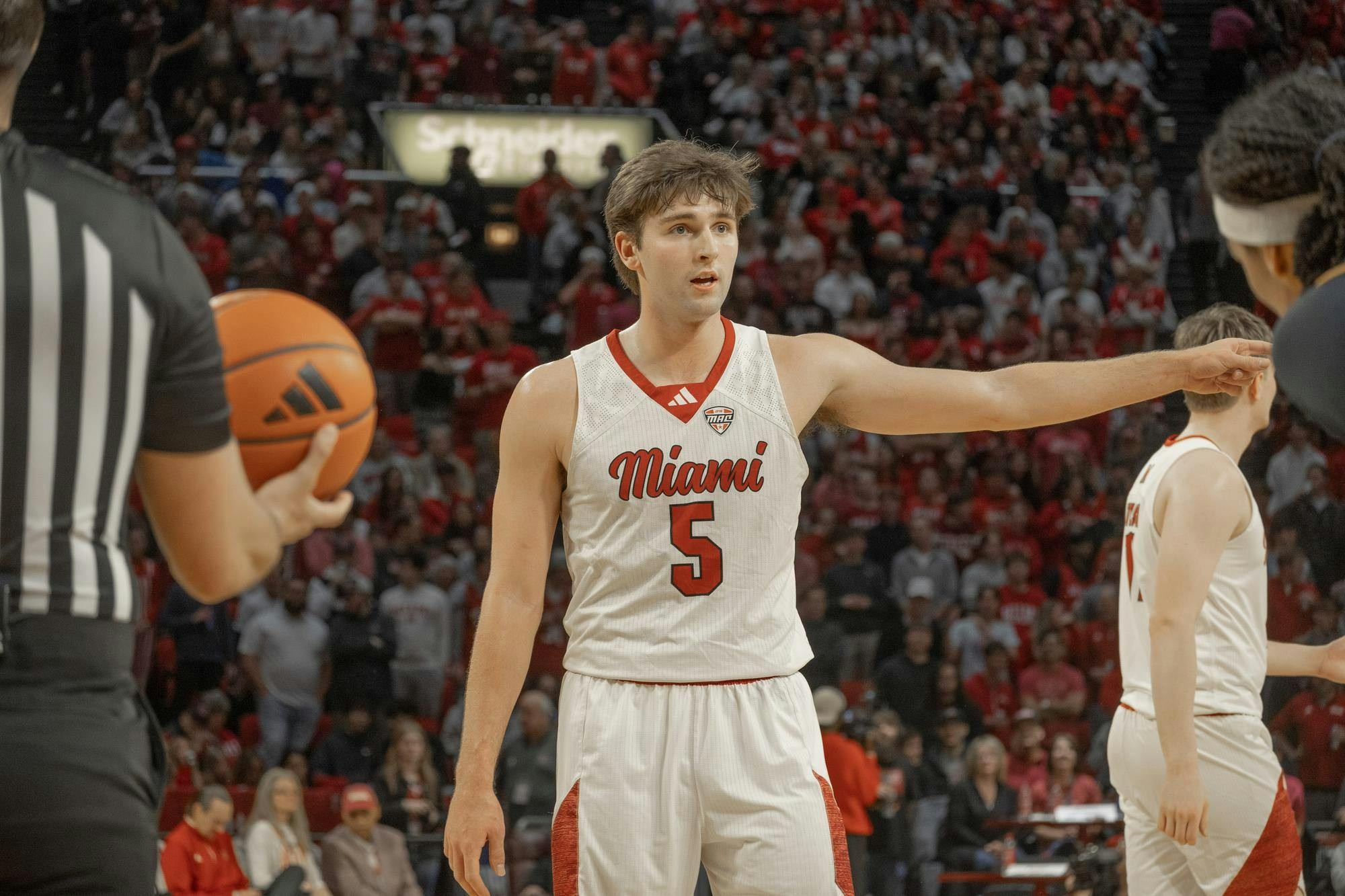 Senior guard Peter Suder directs a teammate in game against the Toledo Rockets. 