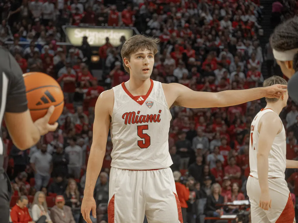 Senior guard Peter Suder directs a teammate in game against the Toledo Rockets.
