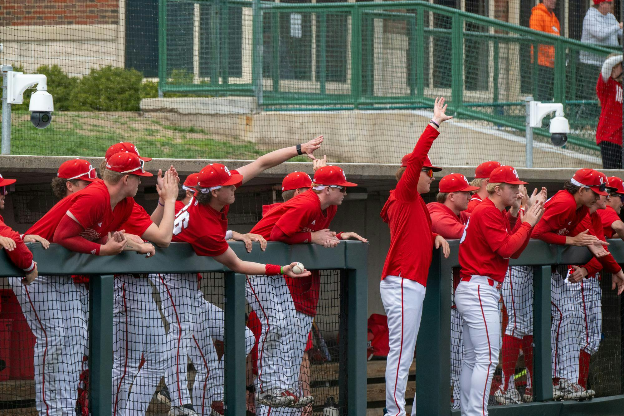 The Miami baseball team applauds and cheers in dugout during game against Kent State at McKie Field on April 13, 2025. 

