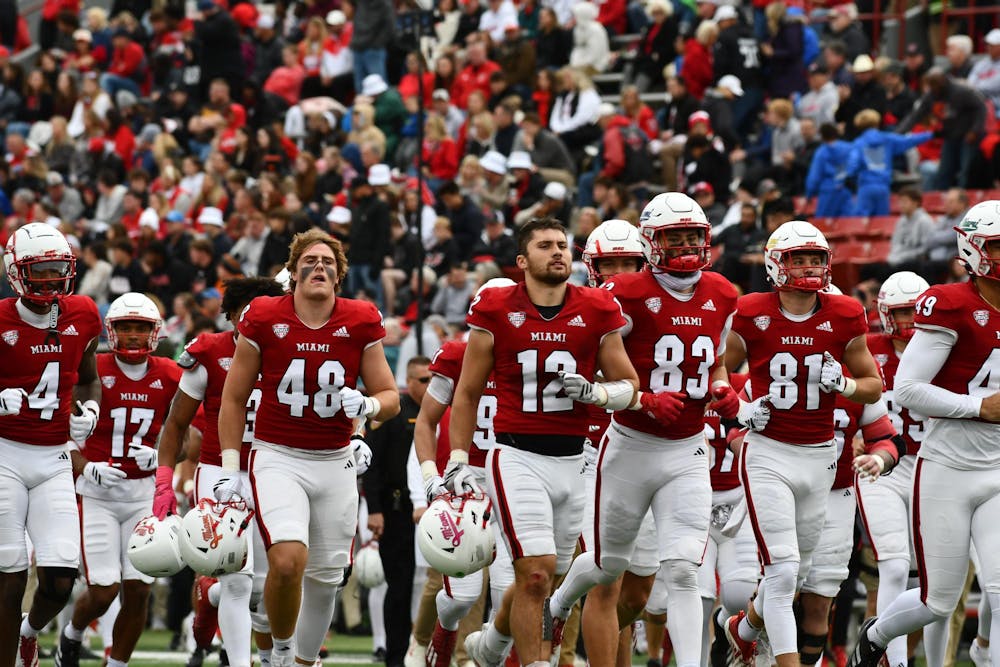 The Miami football team heads to the locker room at halftime against Western Michigan at Yager Stadium on Oct. 25