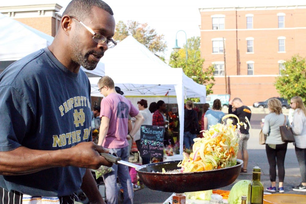 Steve Townsend fries up fresh vegetables at the Oxford Farmers' Market.