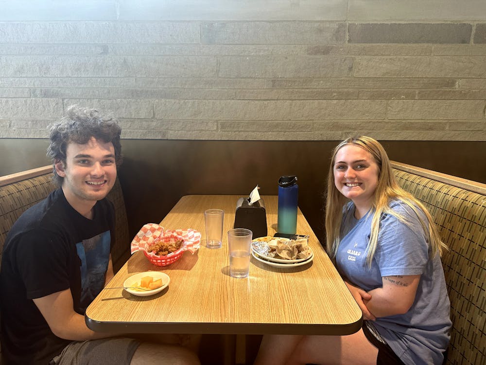 Josh Russell (left) and Mia Wazgar (right) enjoy a meal at Wester Dining Commons.