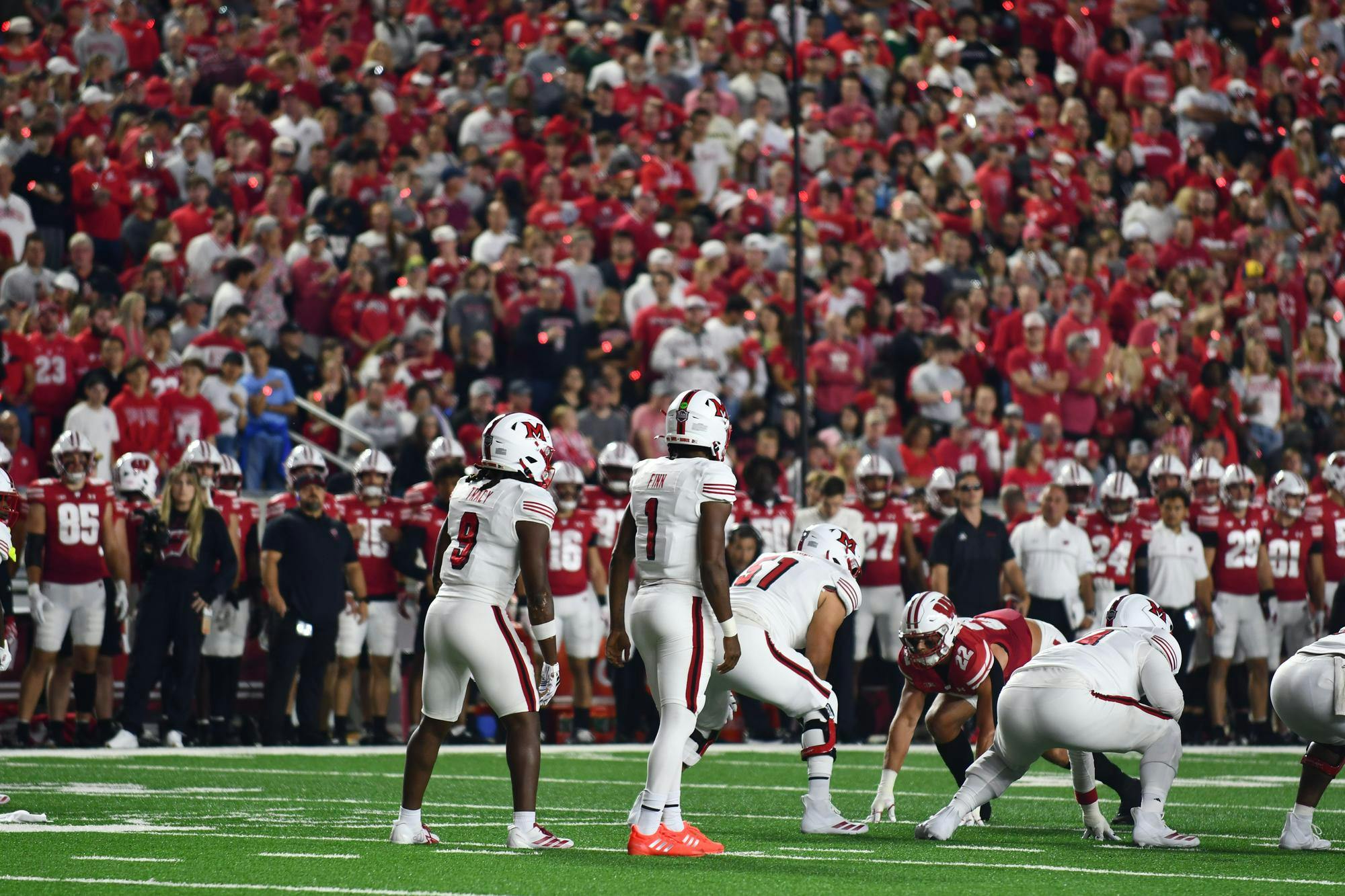 Dequan Finn stands behind center at Camp Randall Stadium against Wisconsin on Aug. 28.