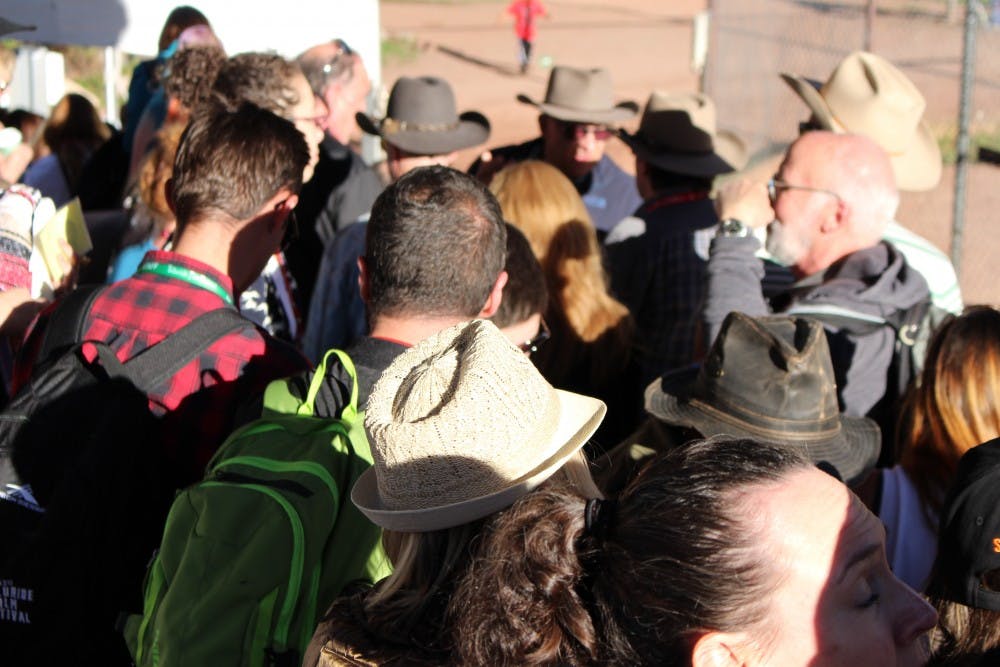 Layered line-waiters on the last day of the festival. The Telluride sun came out at unexpected times, especially blinding when coming out of a dark theater.