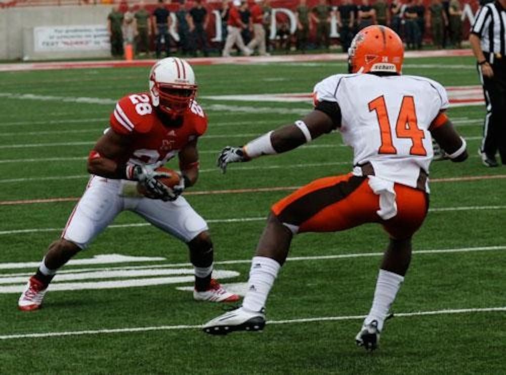 Junior tailback Dan Green tries to shake a Bowling Green State University  defender for extra yards last Saturday. Green and the RedHawks are looking to give Head Coach Don Treadwell his first victory against the University of Cincinnati. 