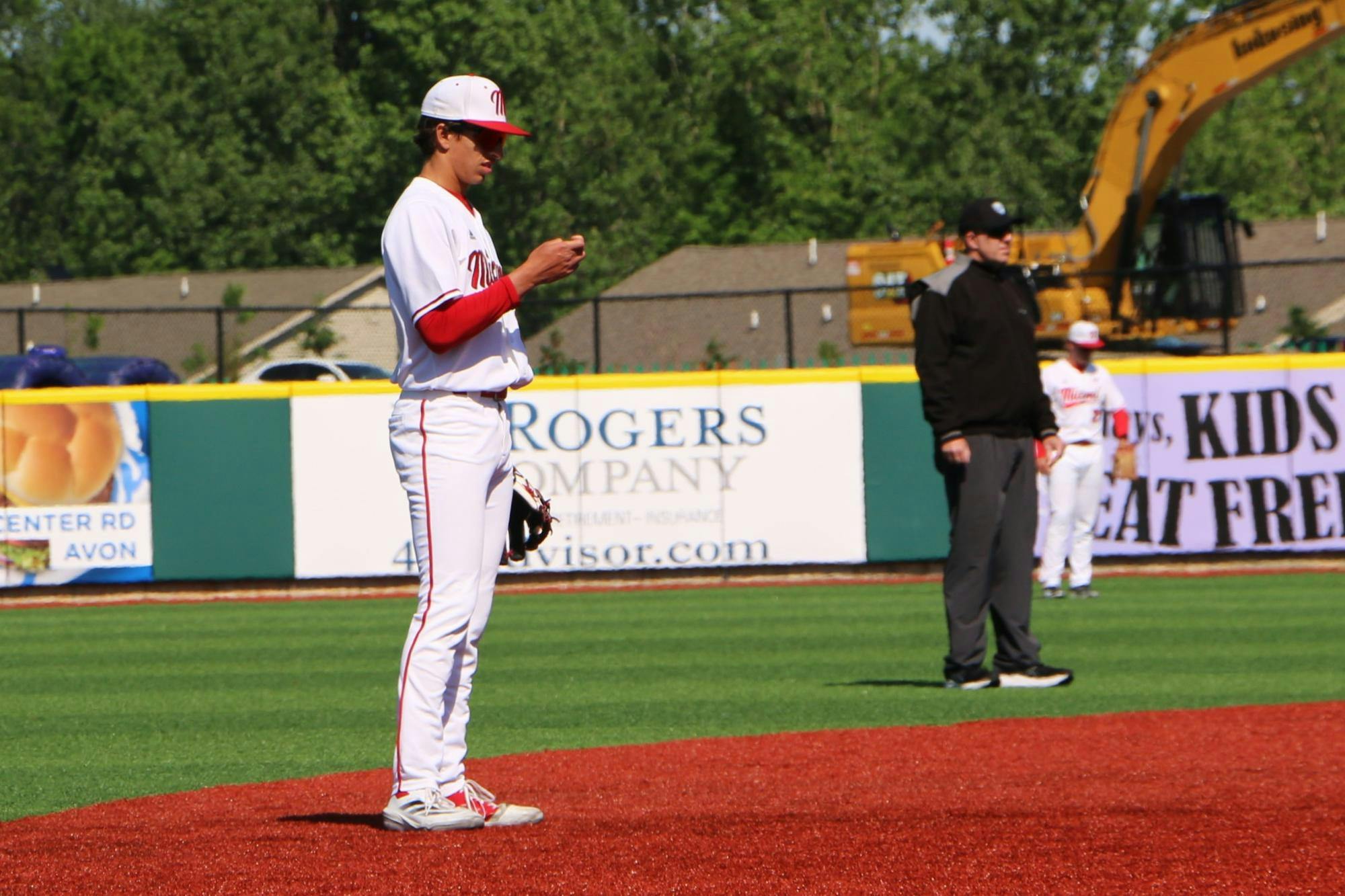 Redshirt-freshman Ignacio Gonzalez checks his lineup card during the MAC tournament on May 21
