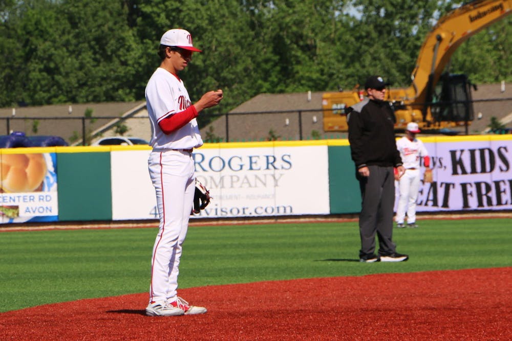 Redshirt-freshman Ignacio Gonzalez checks his lineup card during the MAC tournament on May 21