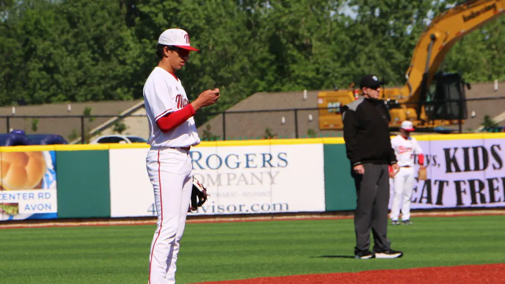 Redshirt-freshman Ignacio Gonzalez checks his lineup card during the MAC tournament on May 21