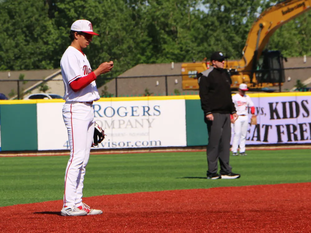 Redshirt-freshman Ignacio Gonzalez checks his lineup card during the MAC tournament on May 21