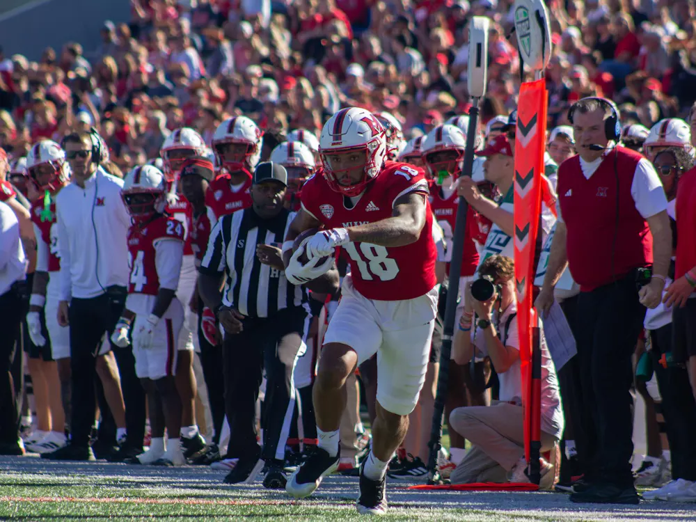 Redshirt-sophomore wide receiver Braylon Isom runs with the ball in game against UConn.