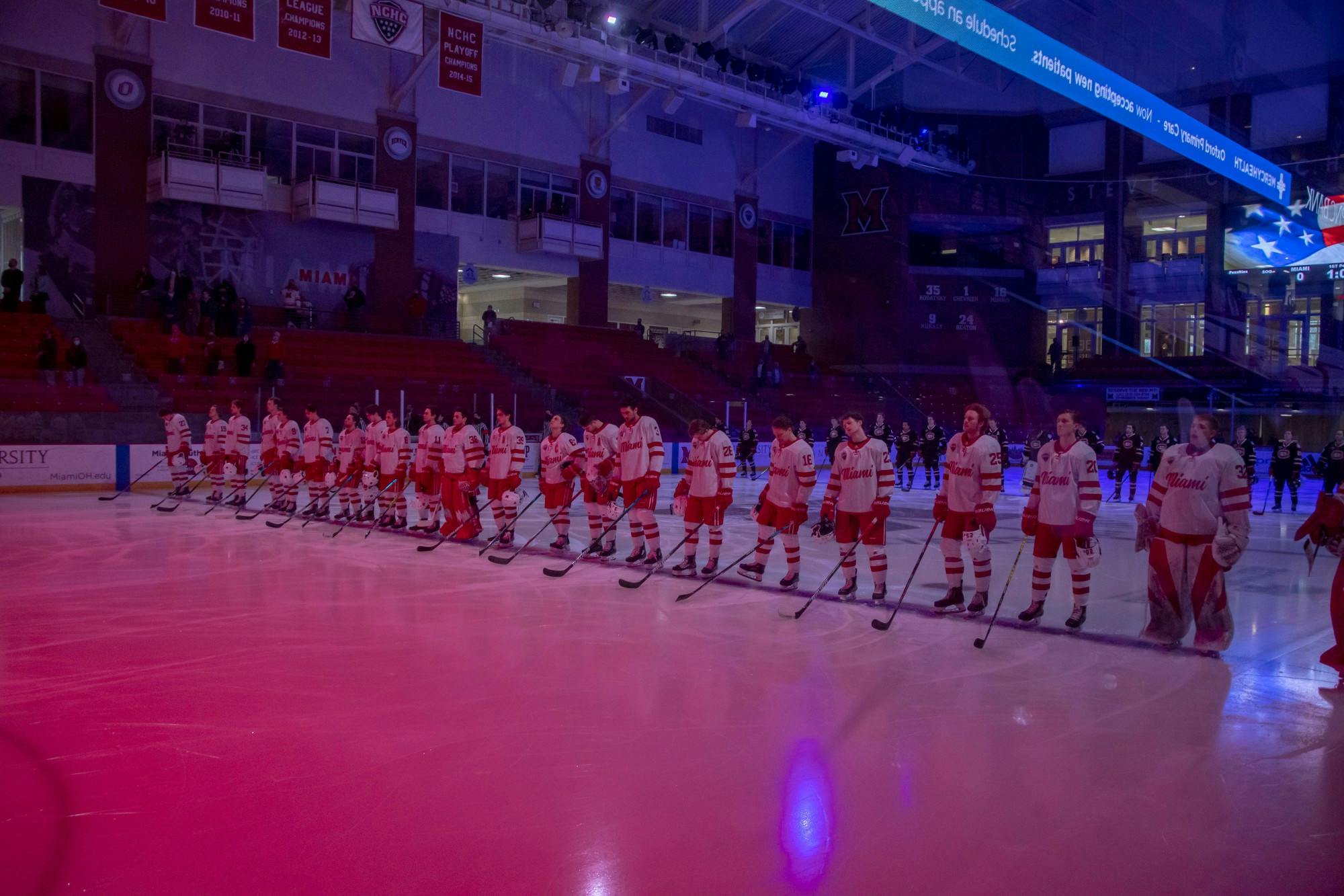 The Miami RedHawks stand at center ice for the Star Spangled Banner before a Feb. 12 contest against St. Cloud State.