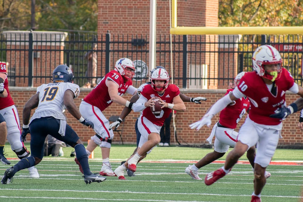 <p>Star junior quarterback Brett Gabbert rushes shortly after the snap against the University of Toledo.</p>