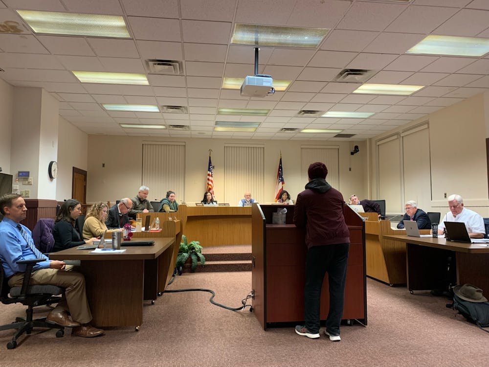 Miami University student Antonio Alejandro advises City Council to consider changing an ordinance on managed natural lawn areas to a resolution.