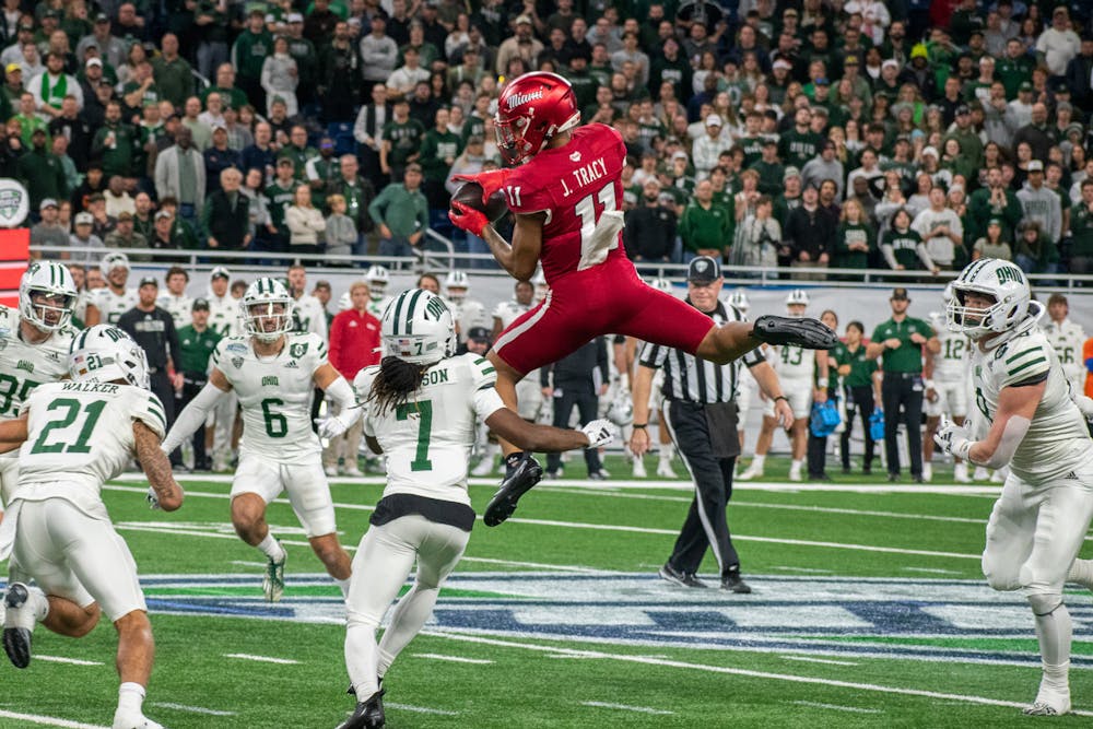 Javon Tracy catching a pass in the air during the first quarter of the 2024 MAC championship