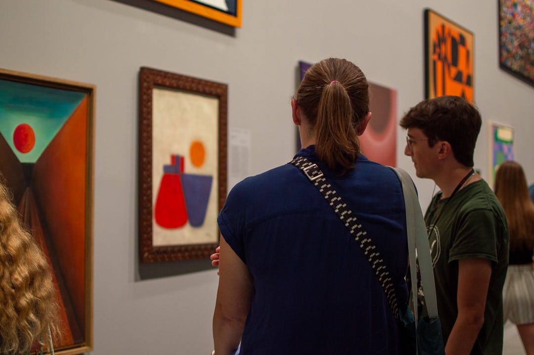 Dr. Annie Dell&#x27;Aria and Connor McClelland discuss artworks hanging in the Biennale’s group show.