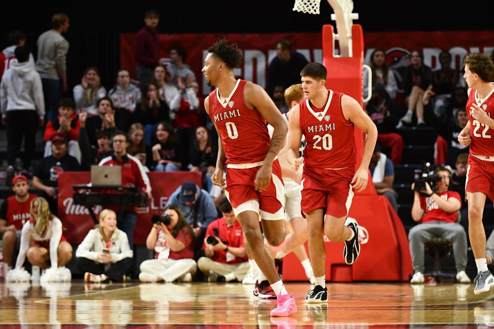 Junior wing Eian Elmer jogs back to defend against Trinity Christian at Millett Hall on Nov. 7