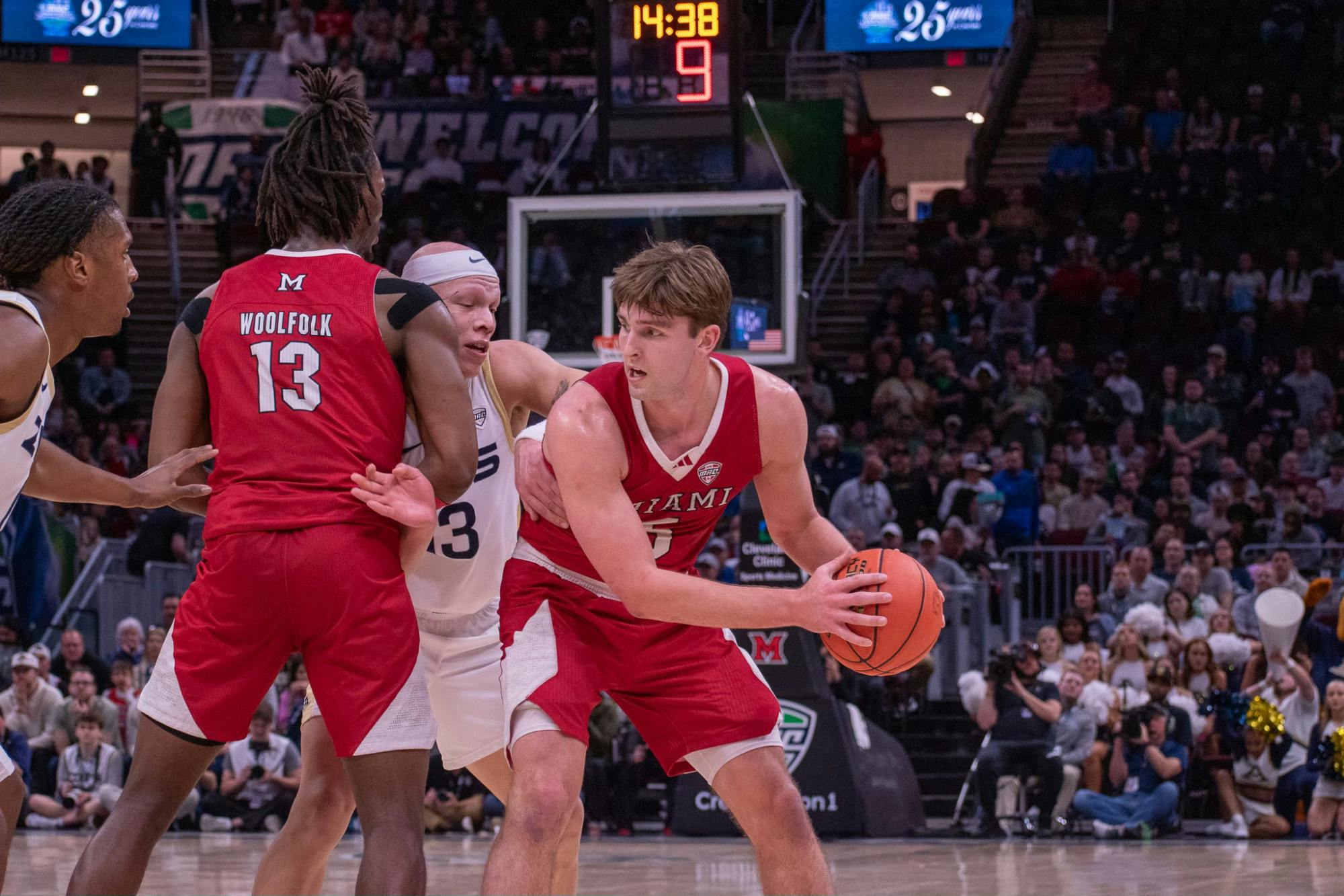 Junior guard Peter Suder looks for an open RedHawk against Akron at Rocket Mortgage Arena on March 15