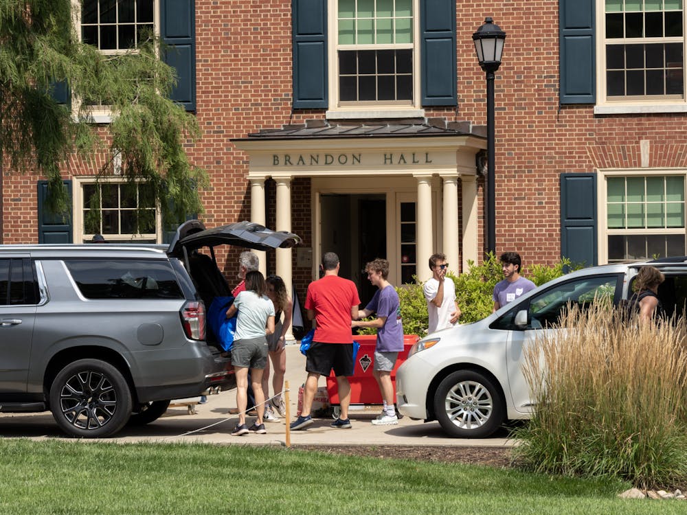 A family unloads the last of their things to move into Brandon Hall.